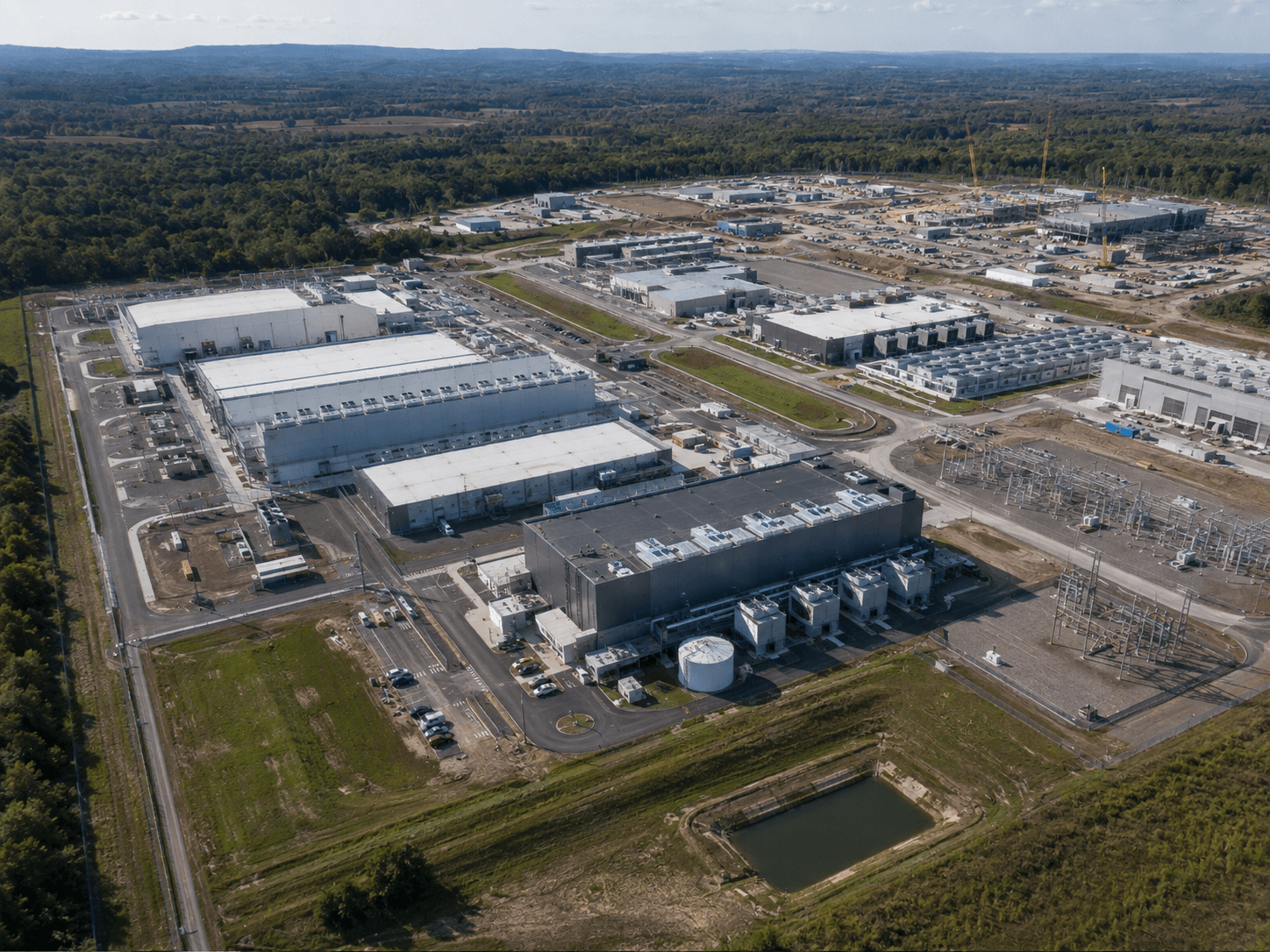 Large multi-building data-center campus with visible utility, mechanical, and expansion interfaces.